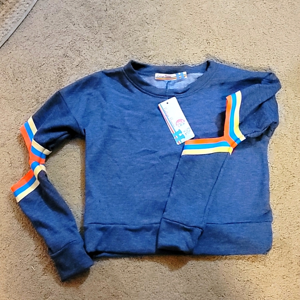 Girls  sweater with open elbows.  Fleece lining.